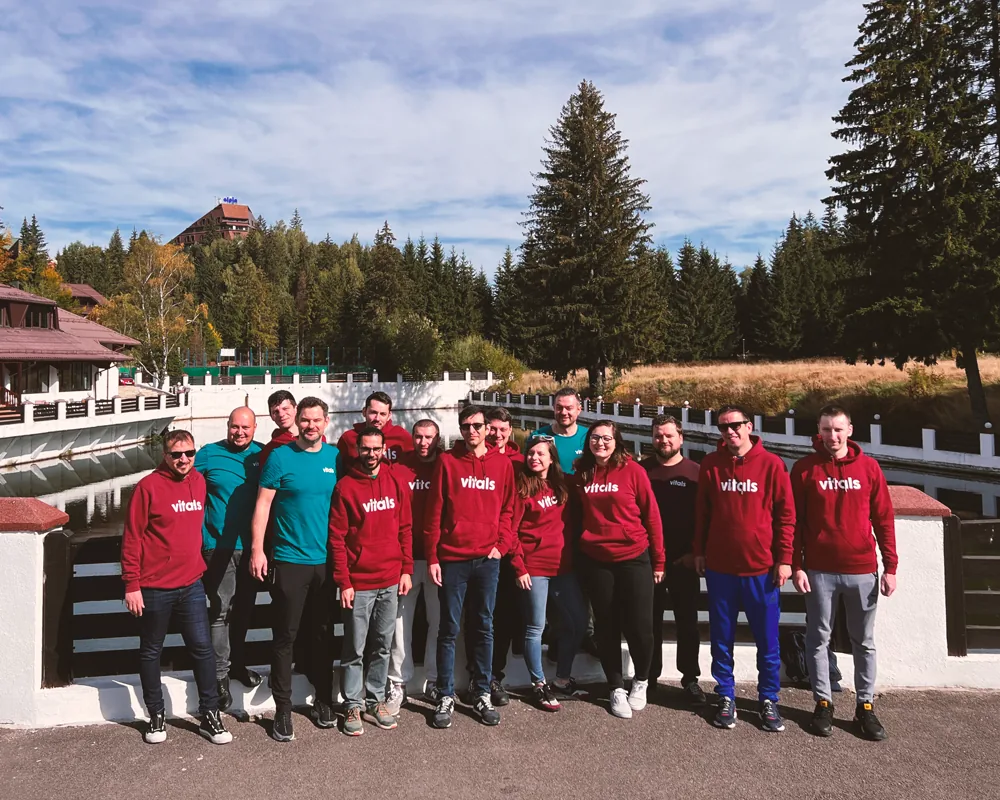 The team by a mountain lake