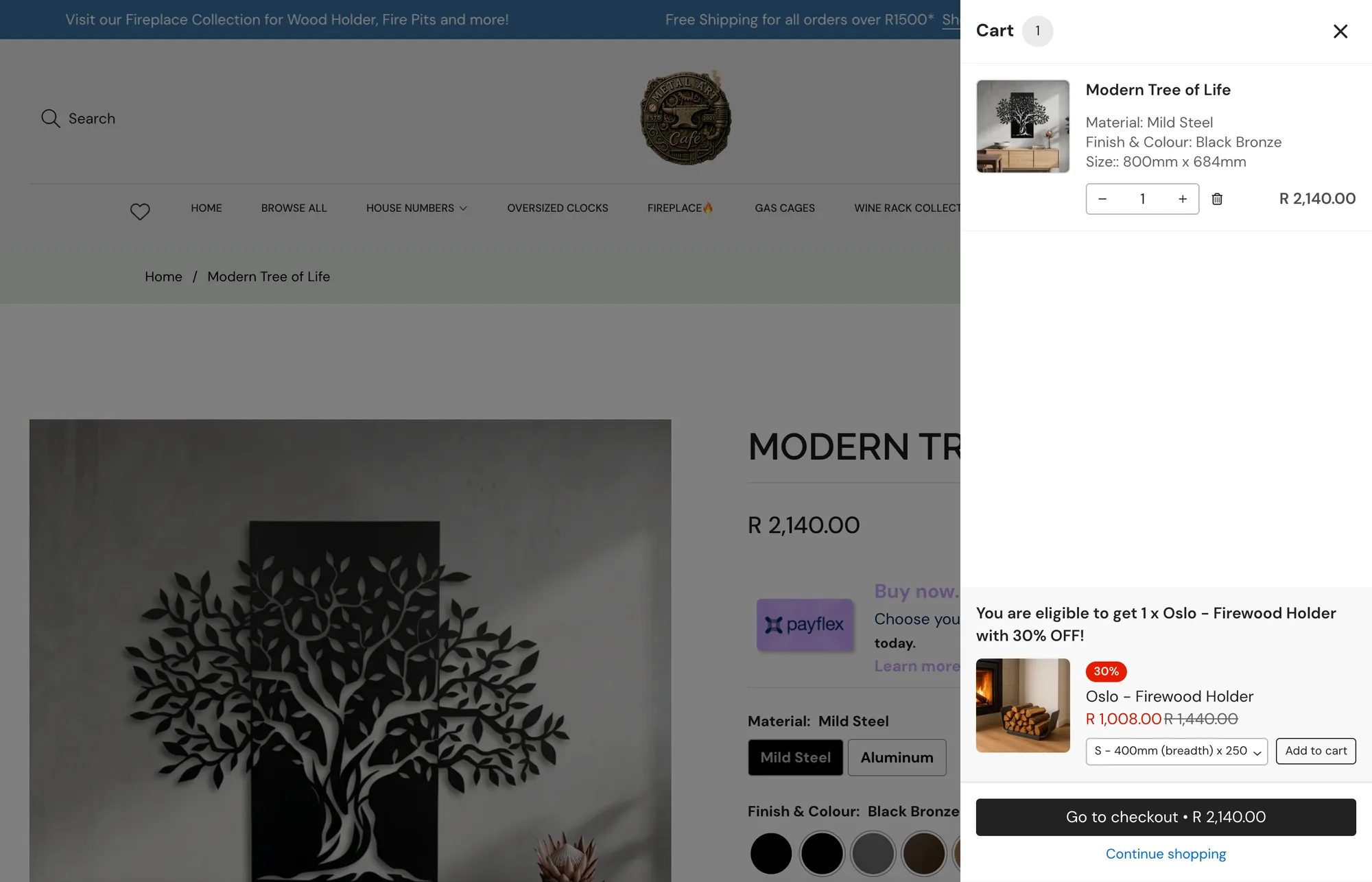 The slide-out cart on metalartcafe.co.za, with a 30% off firewood holder offer at the bottom