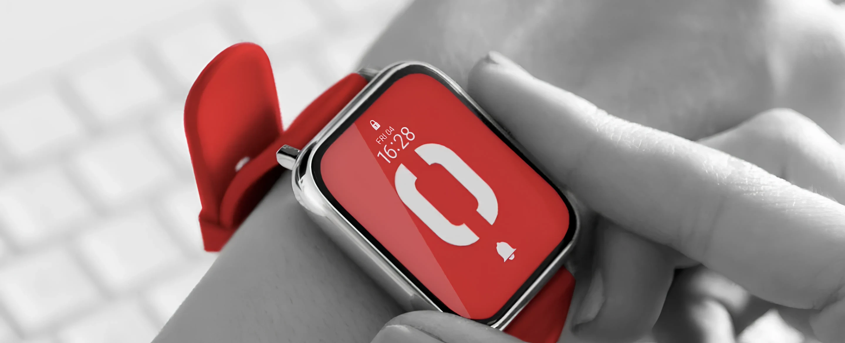 A red Strapsology strap on an Apple Watch